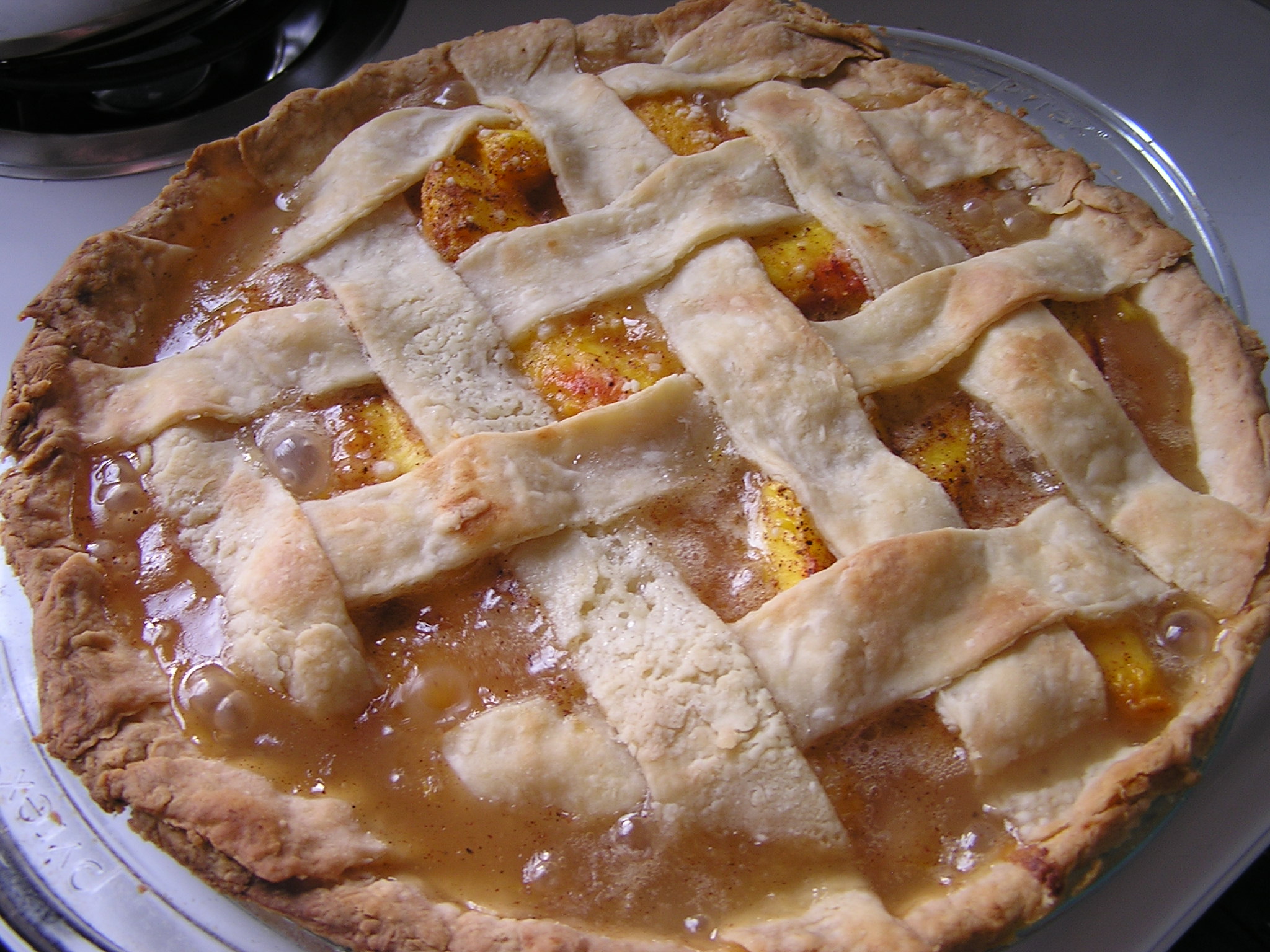 an apple pie is on top of a silver pan