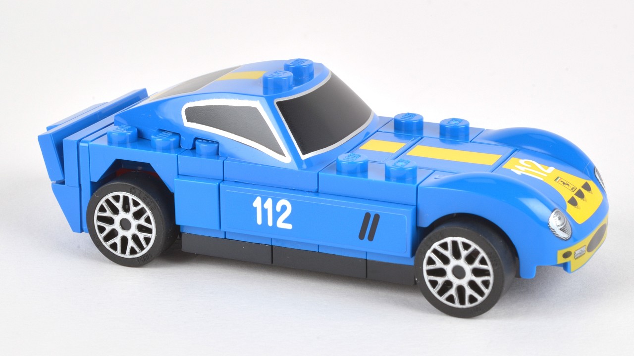 a blue car is sitting in the middle of a white background