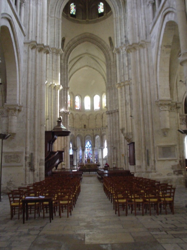 a church filled with pews and tables