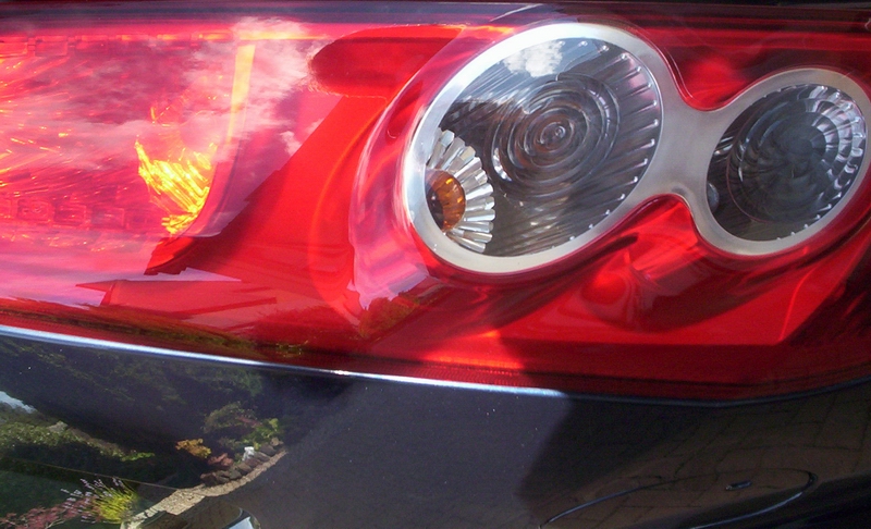 the headlight of a modern looking sports car