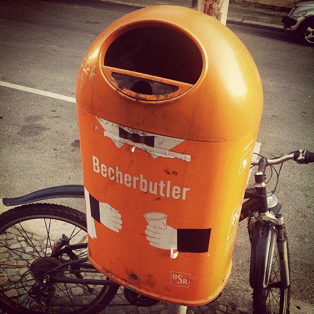 an orange box sits on the side of a bicycle