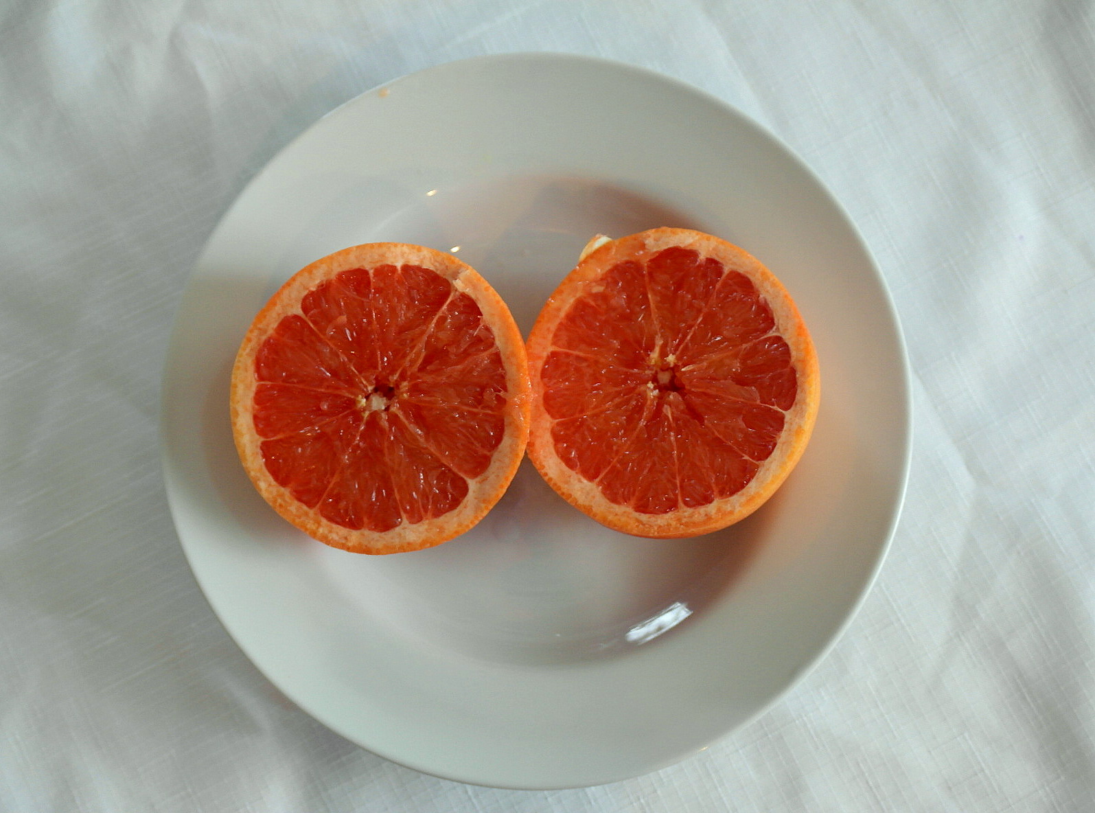 the fresh oranges have been sliced into quarters