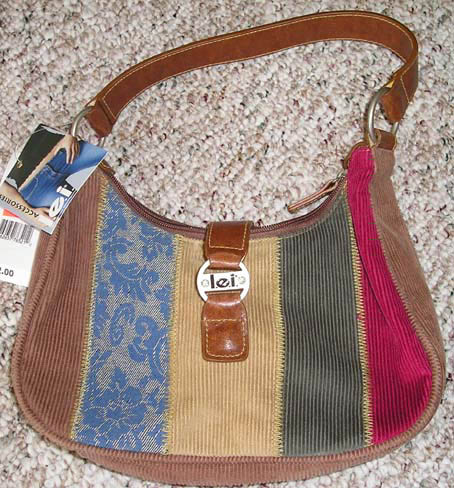 a purse with a tag on the back and strap