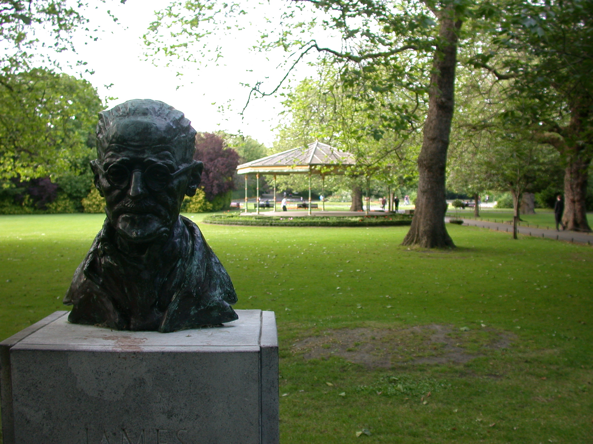 a large statue of a man in a park