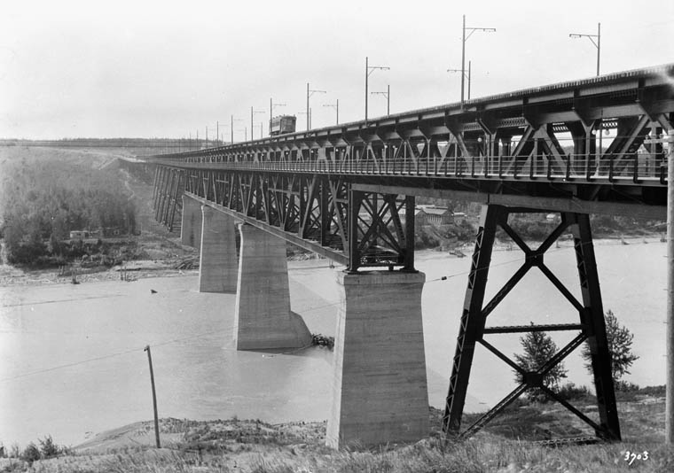 an old picture of the bridge that was built over a river