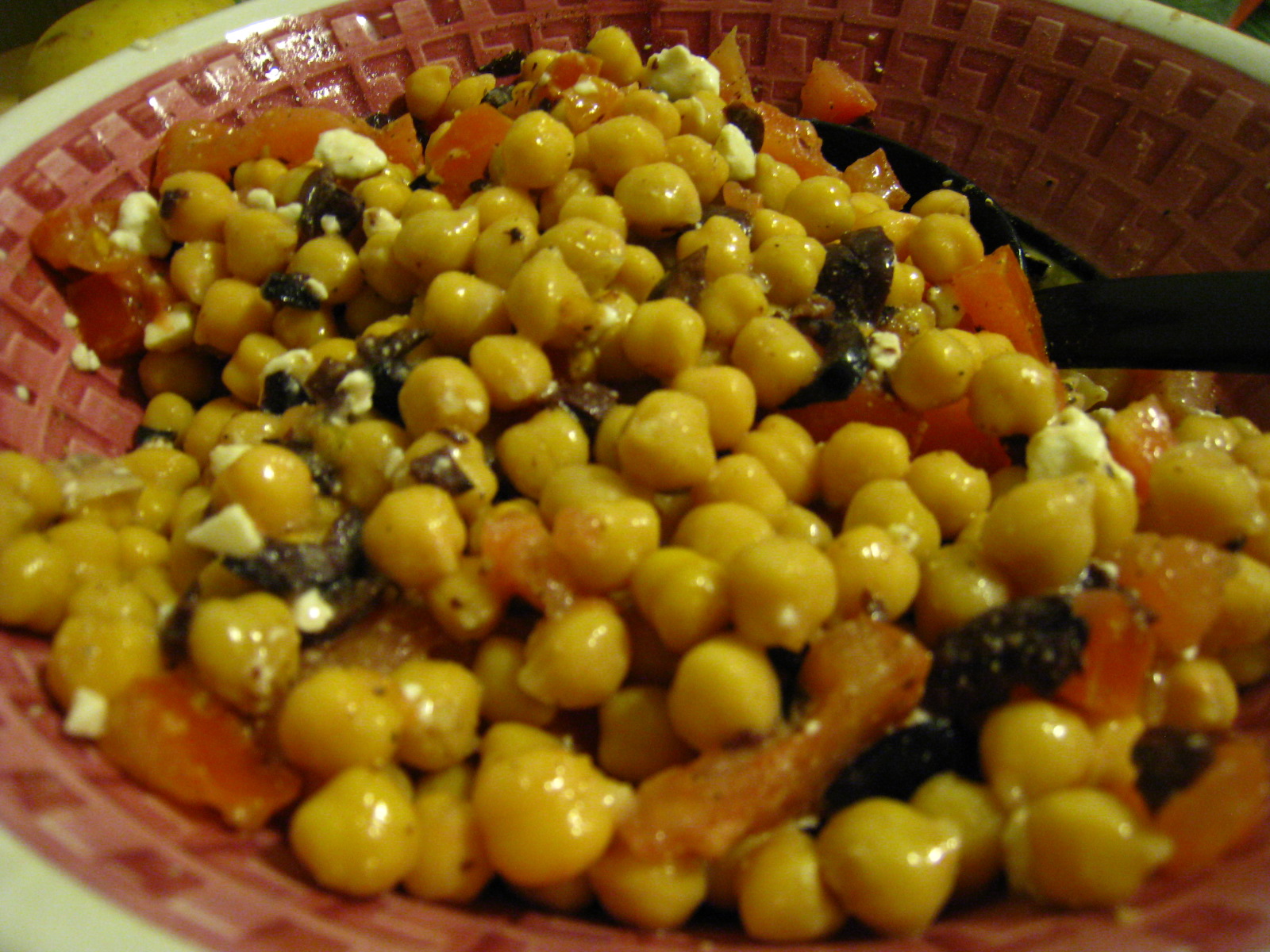 a dish full of beans and cheese sitting on a plate