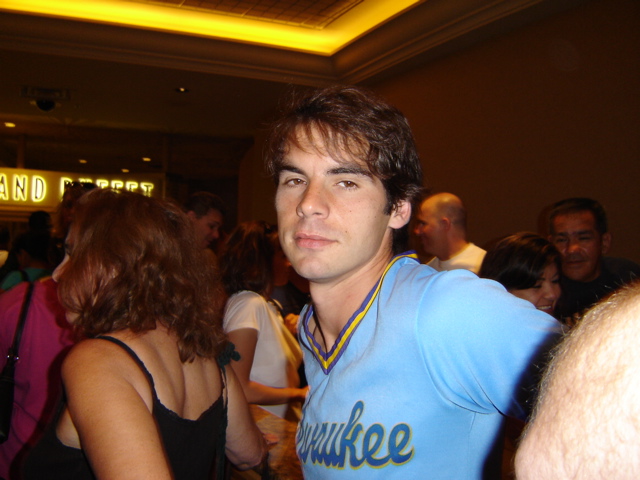 a man in a blue shirt at a party