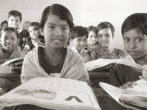 two girls standing beside each other with open books