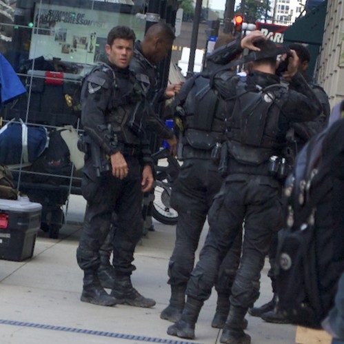 a group of security officers stand in the city