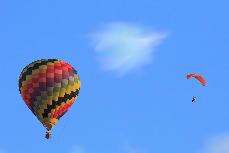 a colorful  air balloon flying high in the sky