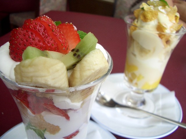 two bowls of food are on a table