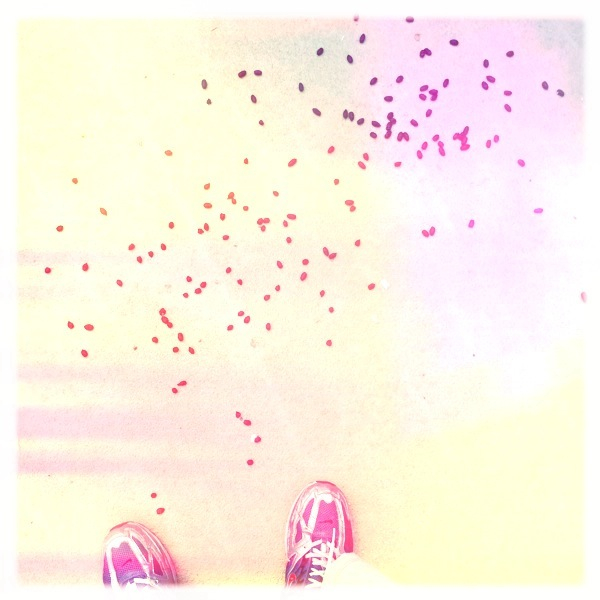 pink shoes with tiny dots flying over