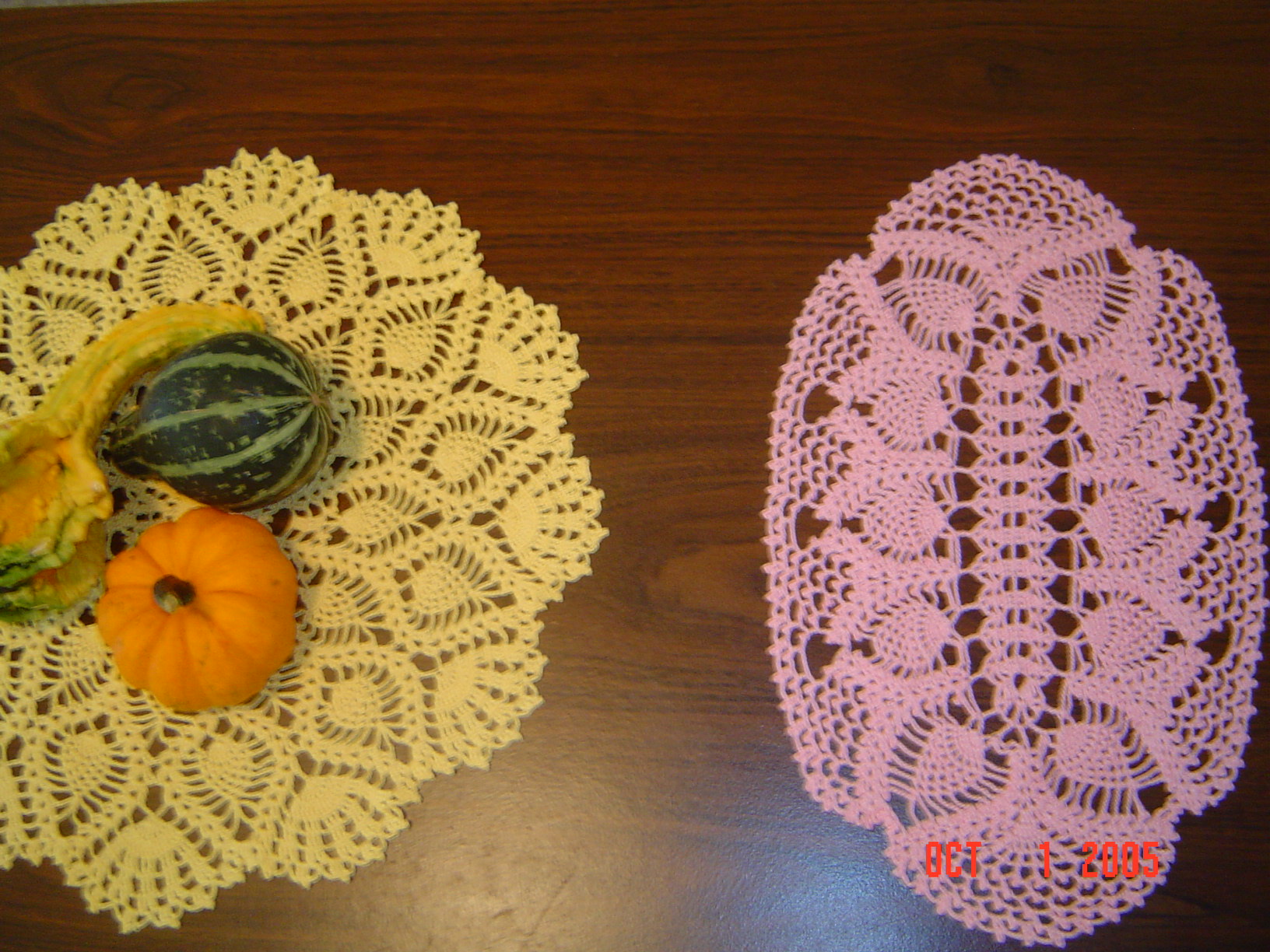 a close up of two doily on a table