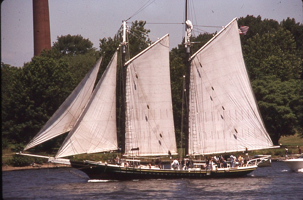 a boat is going on a river with other boats