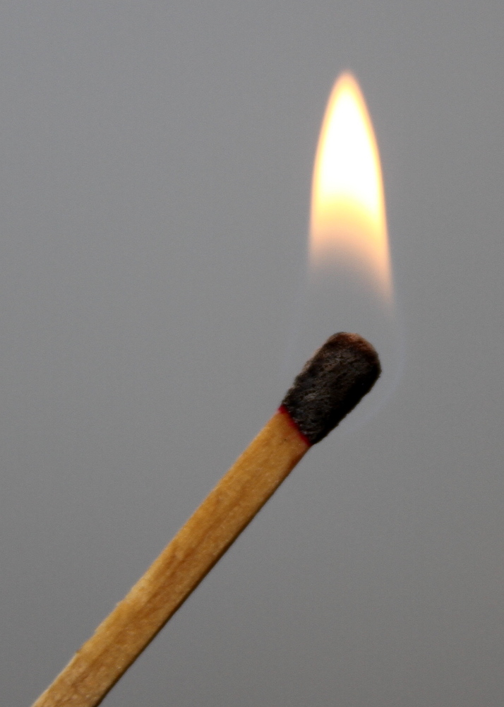 a match stick with a small lit match