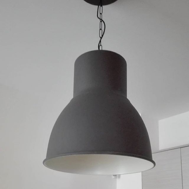 a light fixture hanging in the center of a room