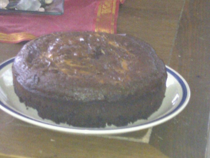 a chocolate cake sitting on top of a white plate