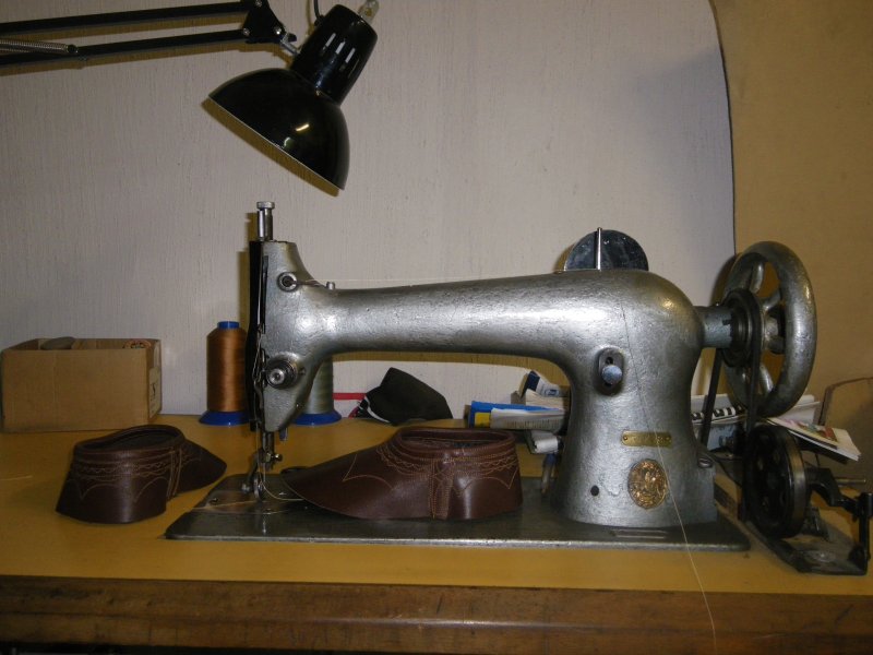 a close - up of a sewing machine with several items