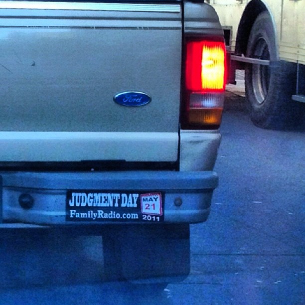 a grey truck with a license plate with the letter s