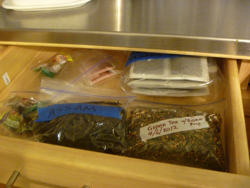 a drawer full of various herbs and food