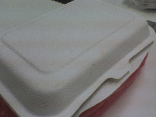 a plain white, red and grey paper napkin