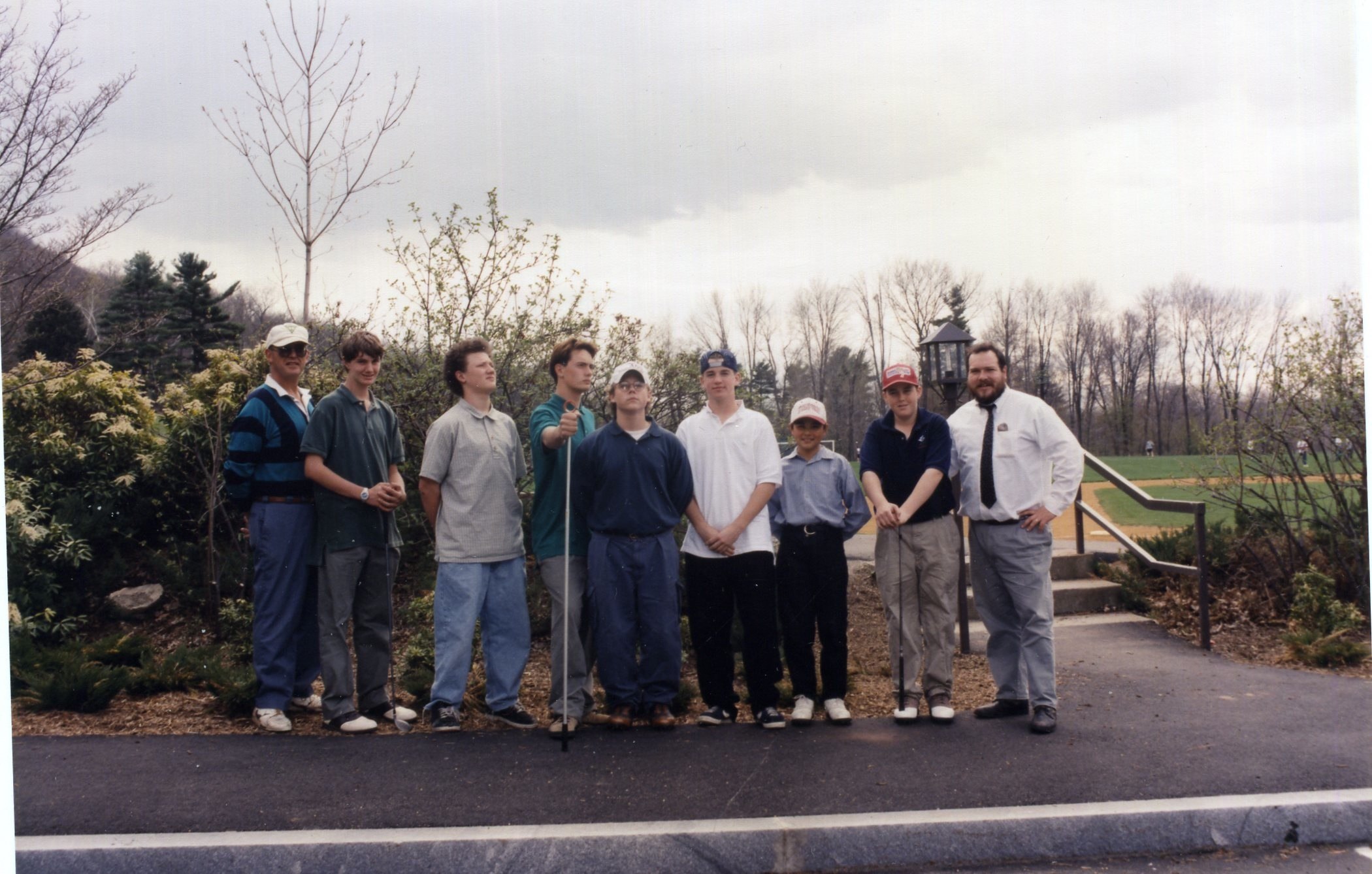 a group of people standing on the street