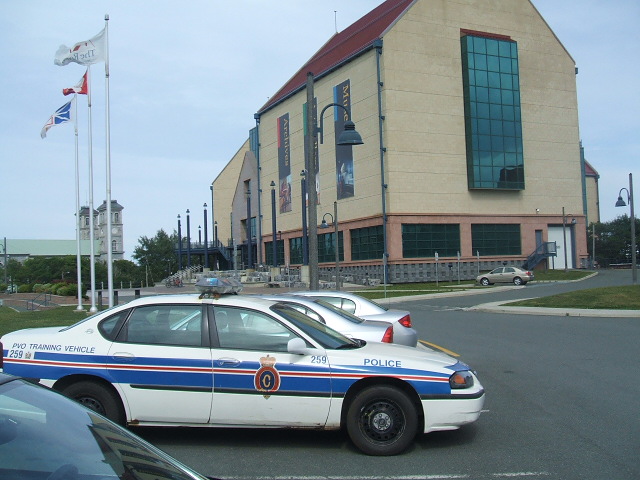 a police car that is parked in front of a building