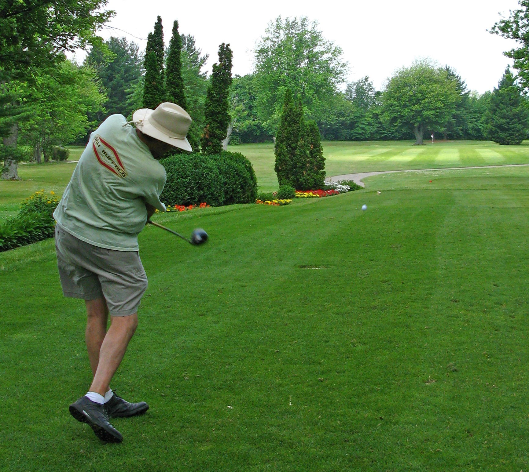 a man hitting golf balls with a club