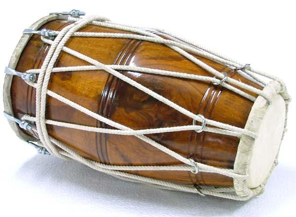 a large wooden djemblage is attached to a white cord