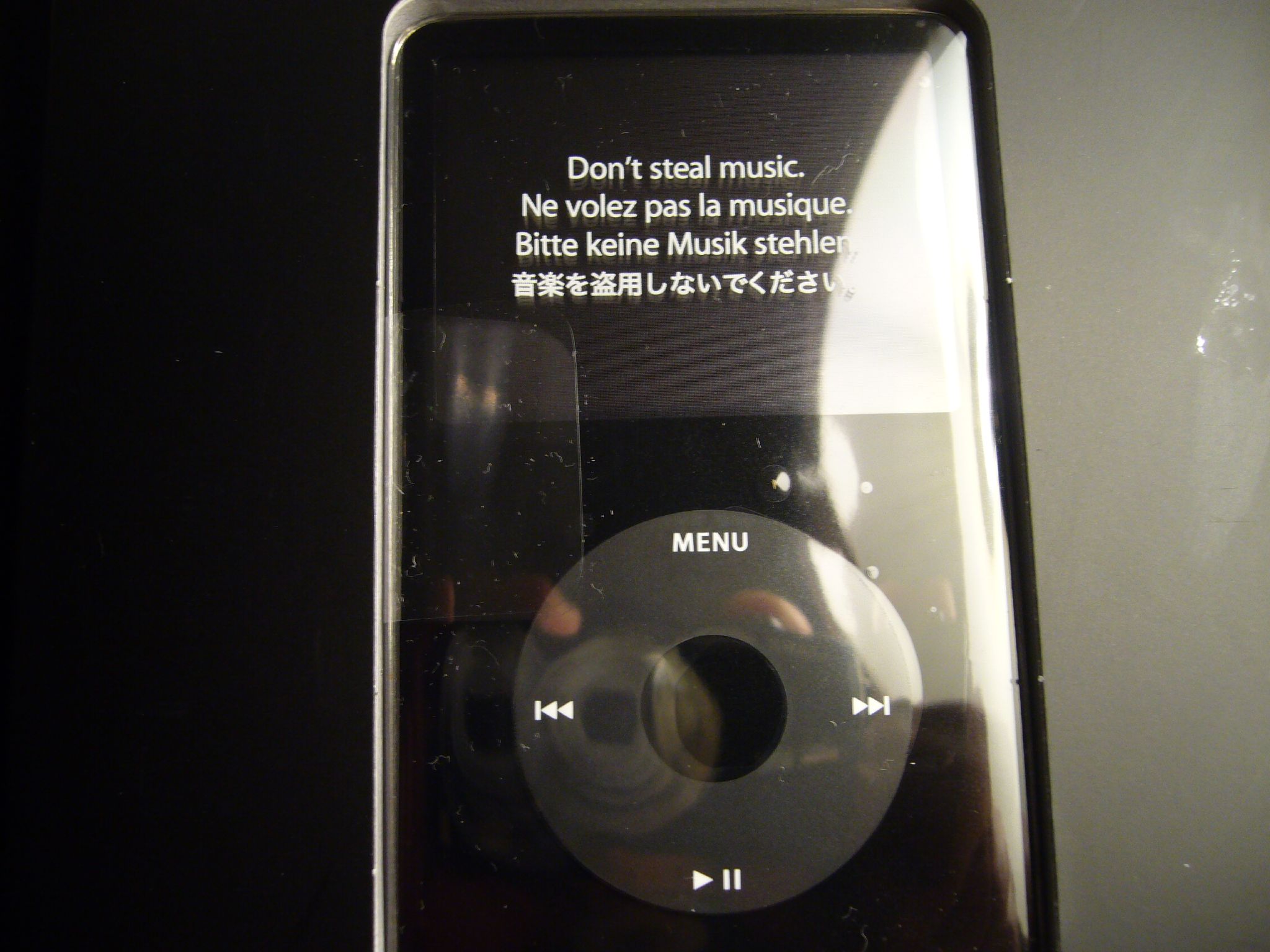 an ipod in a case with the saying don't steal music