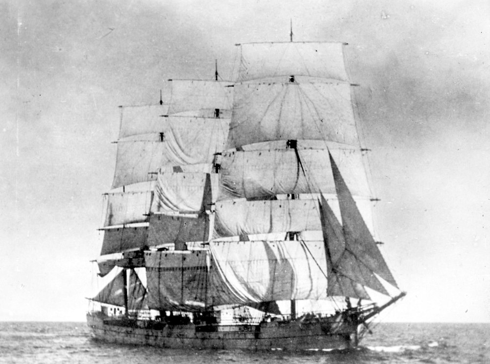 this old black and white po shows a sail boat with three sails