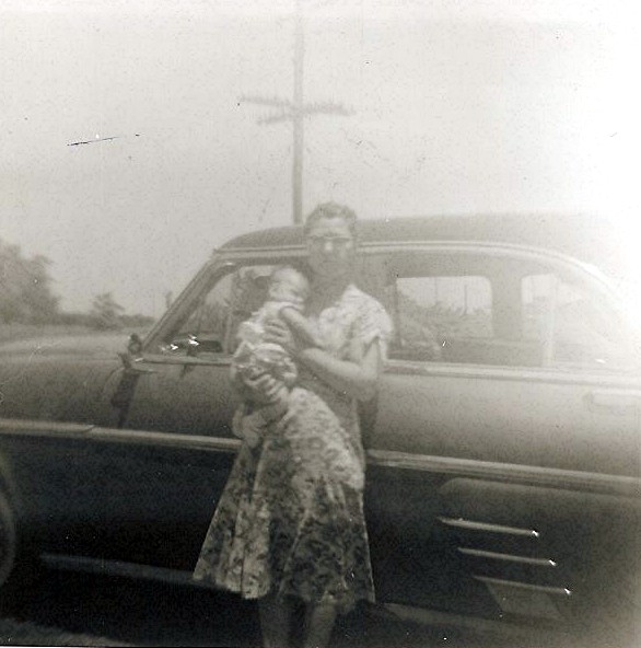 old time black and white pograph of a woman with child in her arms