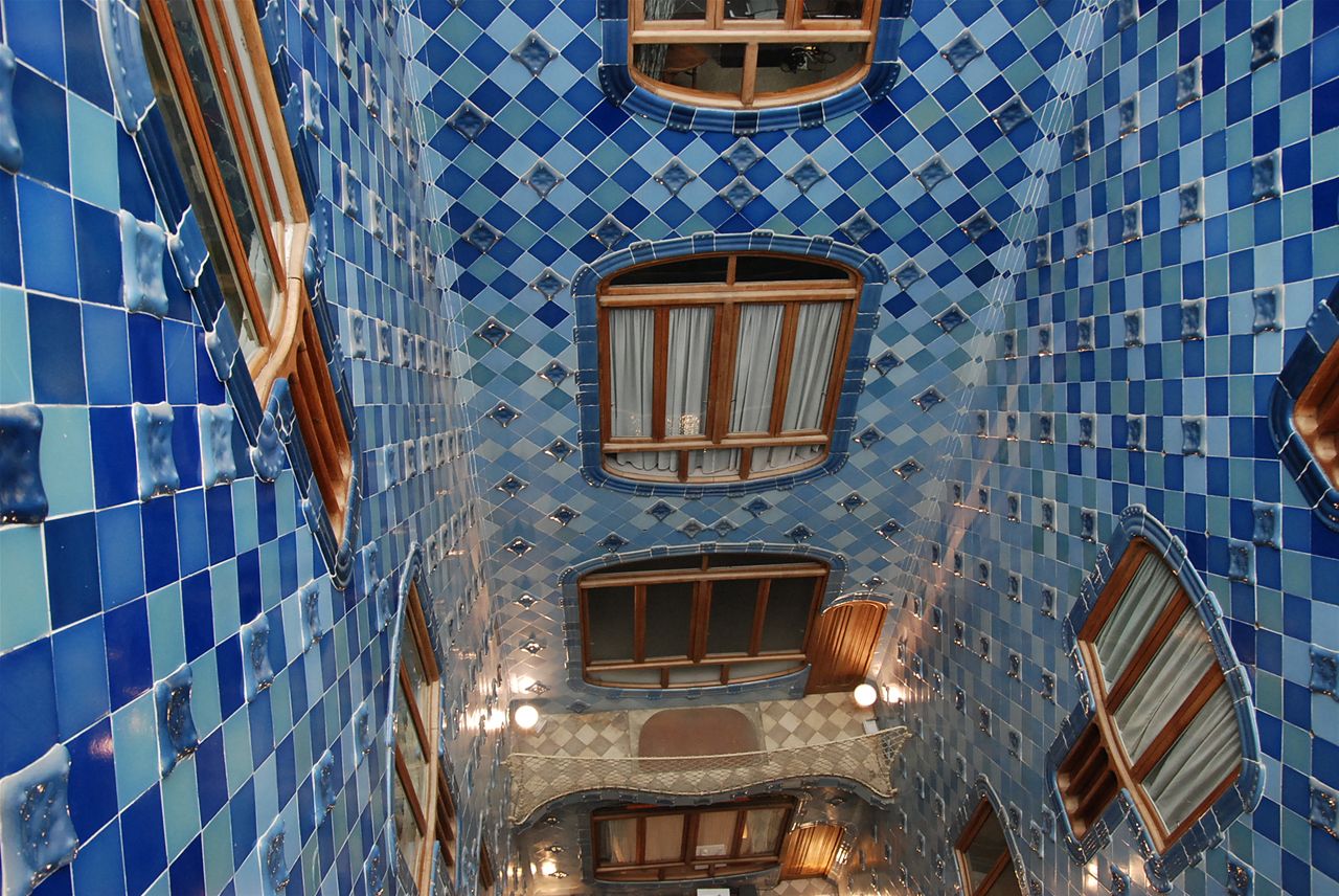 the building features blue tile walls and ceiling and windows