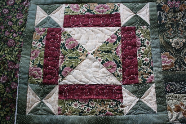 a quilted object made to look like a wall hanging