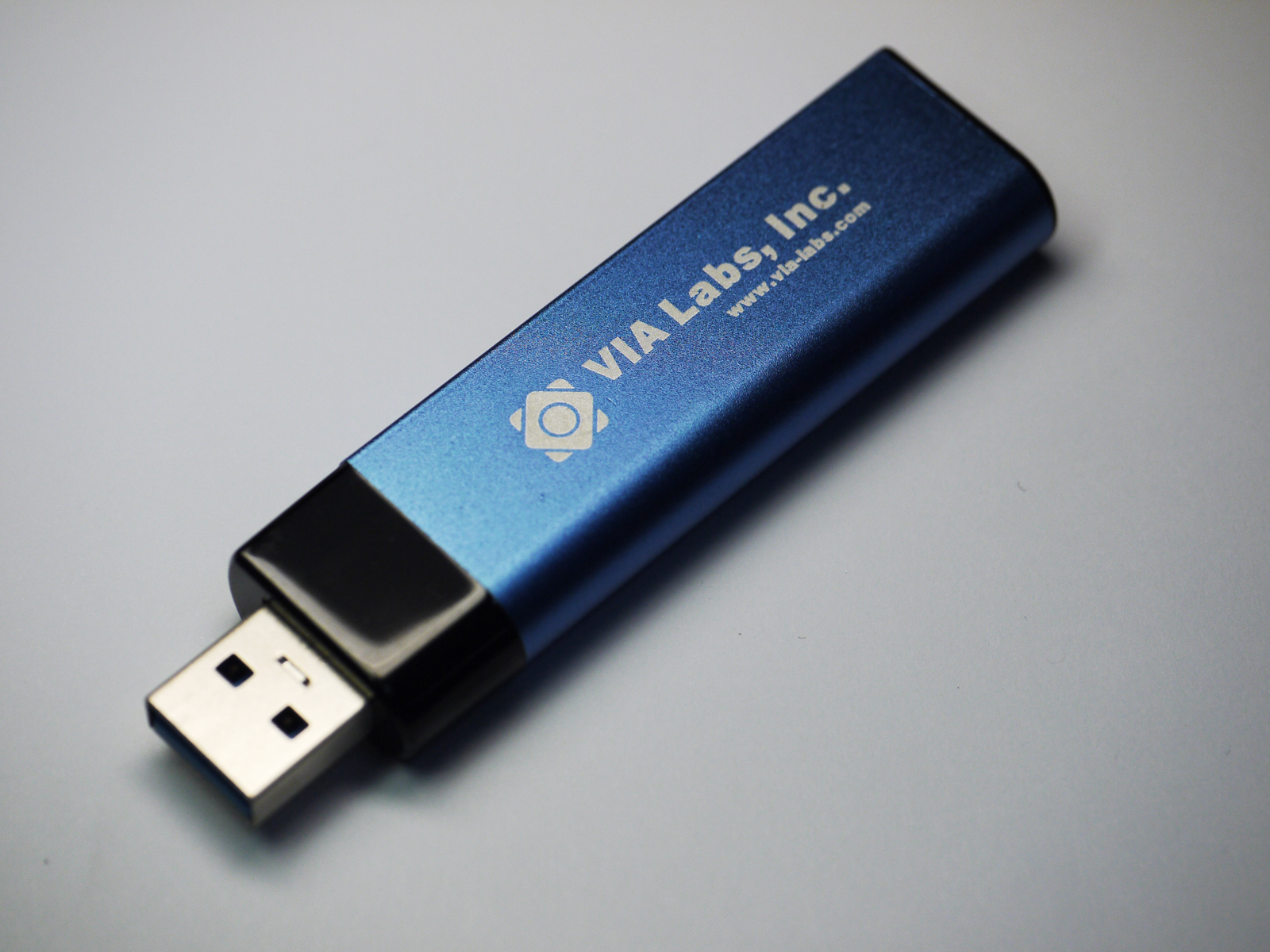 a blue and black usb device with the words wild tech written on it