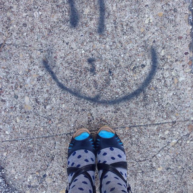 a close up of a persons feet with a smiley face drawn on it