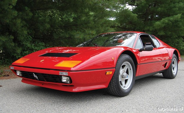 a ferrari type car is sitting in the road