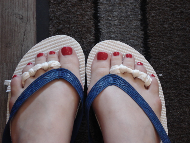 feet with sandles, sandals and nail polish in them