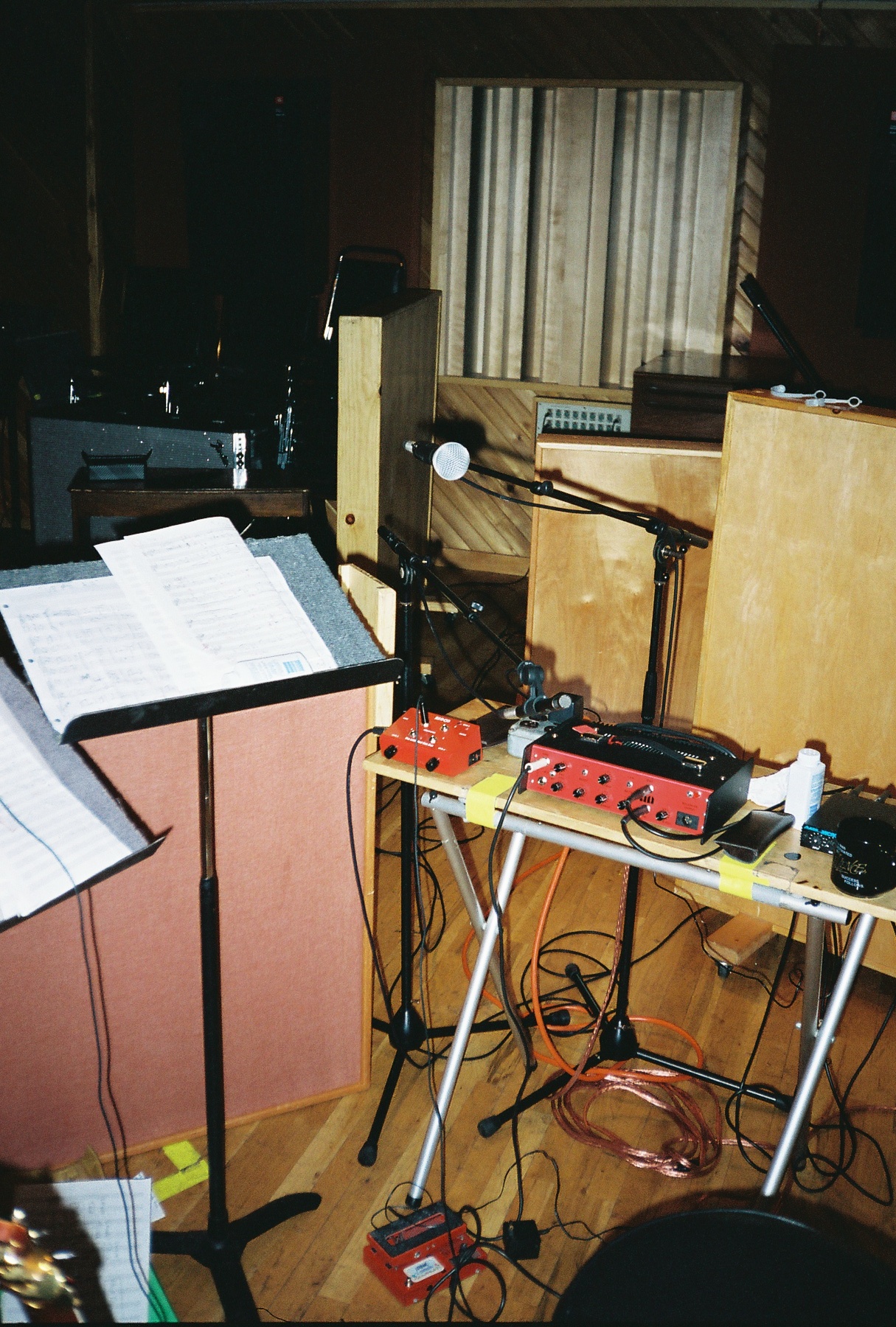 a sound board with electronic equipment and sheet music
