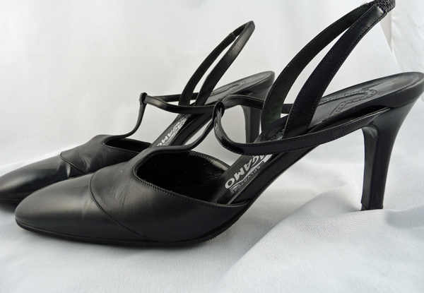 a pair of black leather high heels