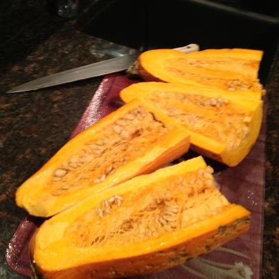 a knife is shown  up the top of the pumpkins