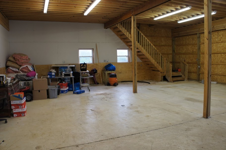 inside view of a wood garage with stairs on the walls