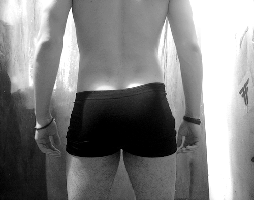 the back of a man's underwear on, showing the lower torso