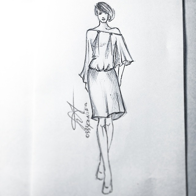 a pencil drawing of a dress from a designer fashion magazine