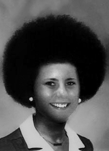 an african american woman with a very big afro