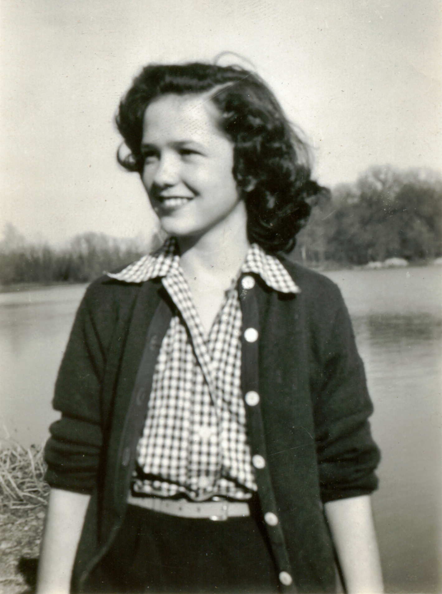 black and white pograph of young woman with curly hair