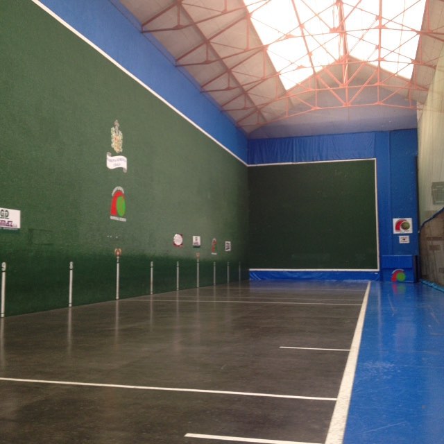 an indoor tennis court with several lanes to go around