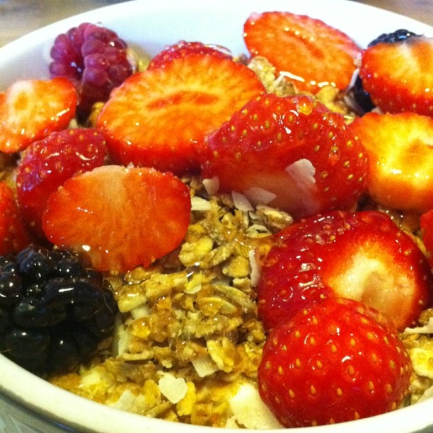 a bowl filled with lots of fruit and oats