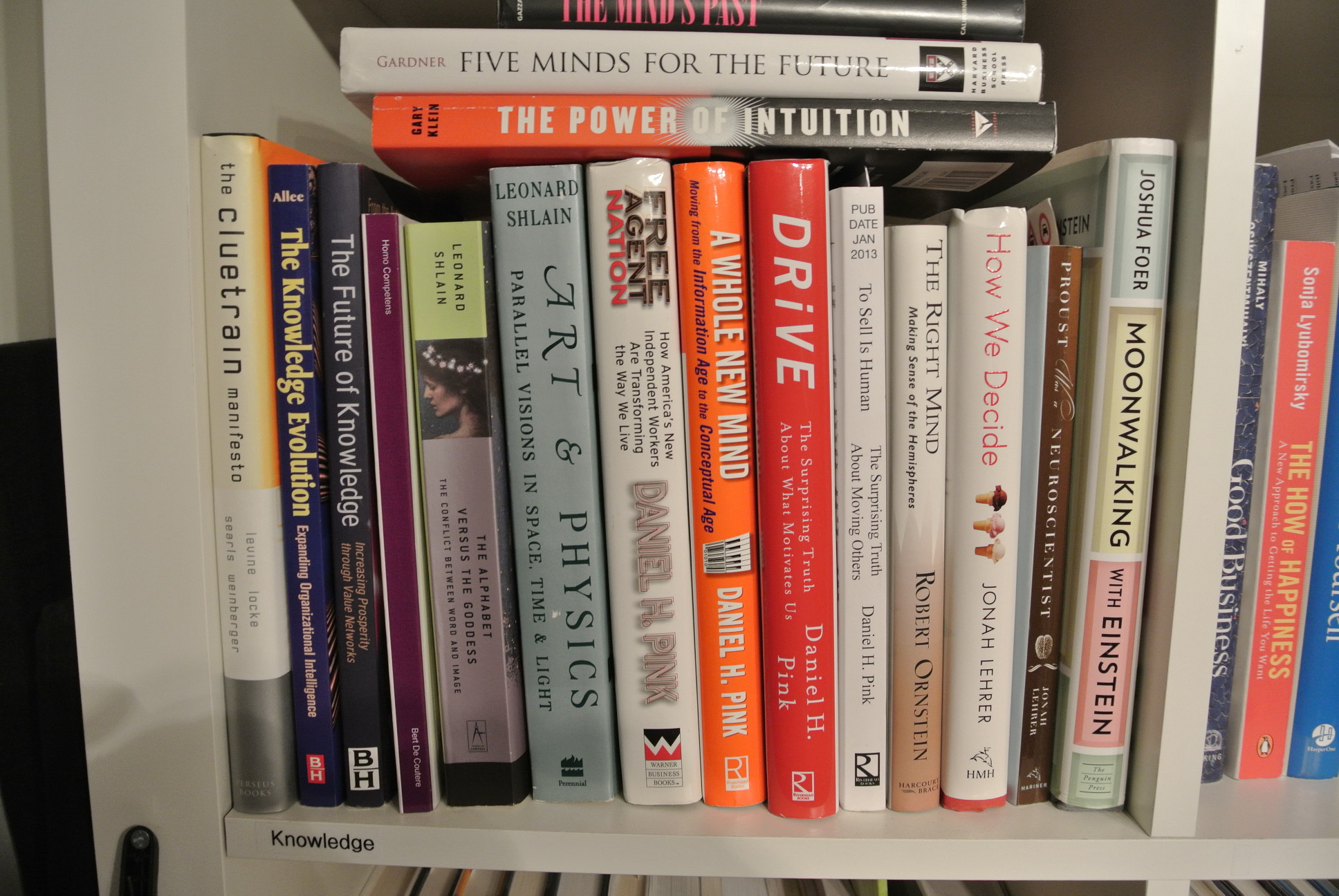 a bookshelf full of books about the power of thinking
