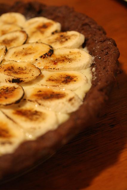 an image of a pie with bananas on top